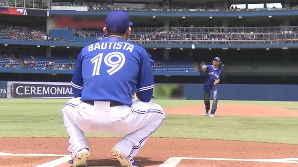 Jose Bautista Catching 1st Pitch from TD Customer at Toronto Blue Jays Game Photo: ctvnews.com