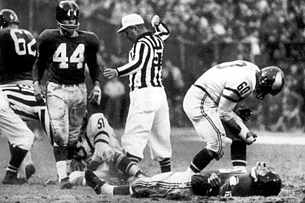 Frank Gifford (on ground), Chuck Bednarik  photo:cbssports.com