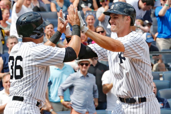 Carlos Beltran High 5's Greg Bird After He Hit His 1st Major League HR  photo:paul j. bereswill