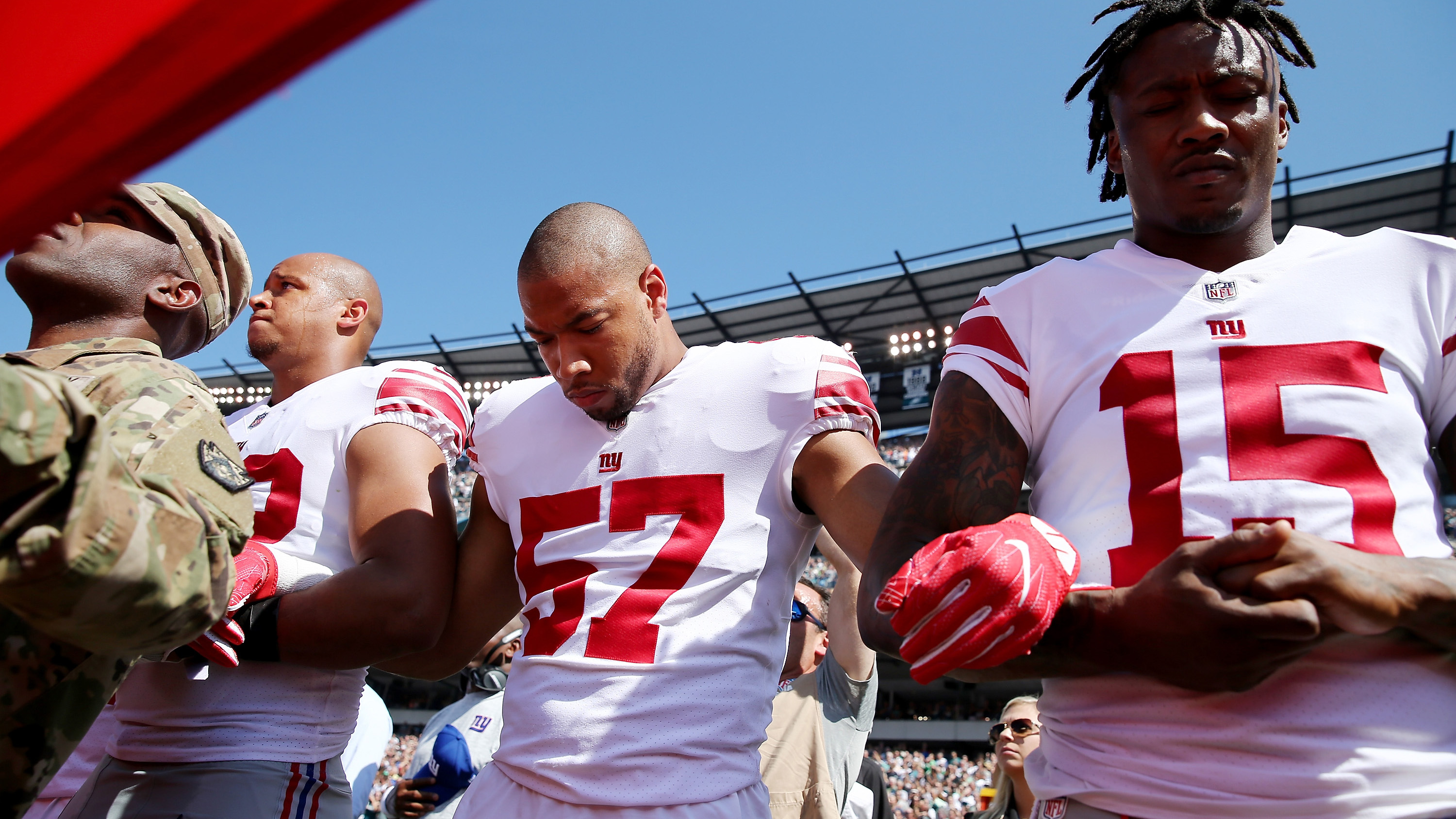 NFL Players Linking Arms in Solidarity Against Trump...